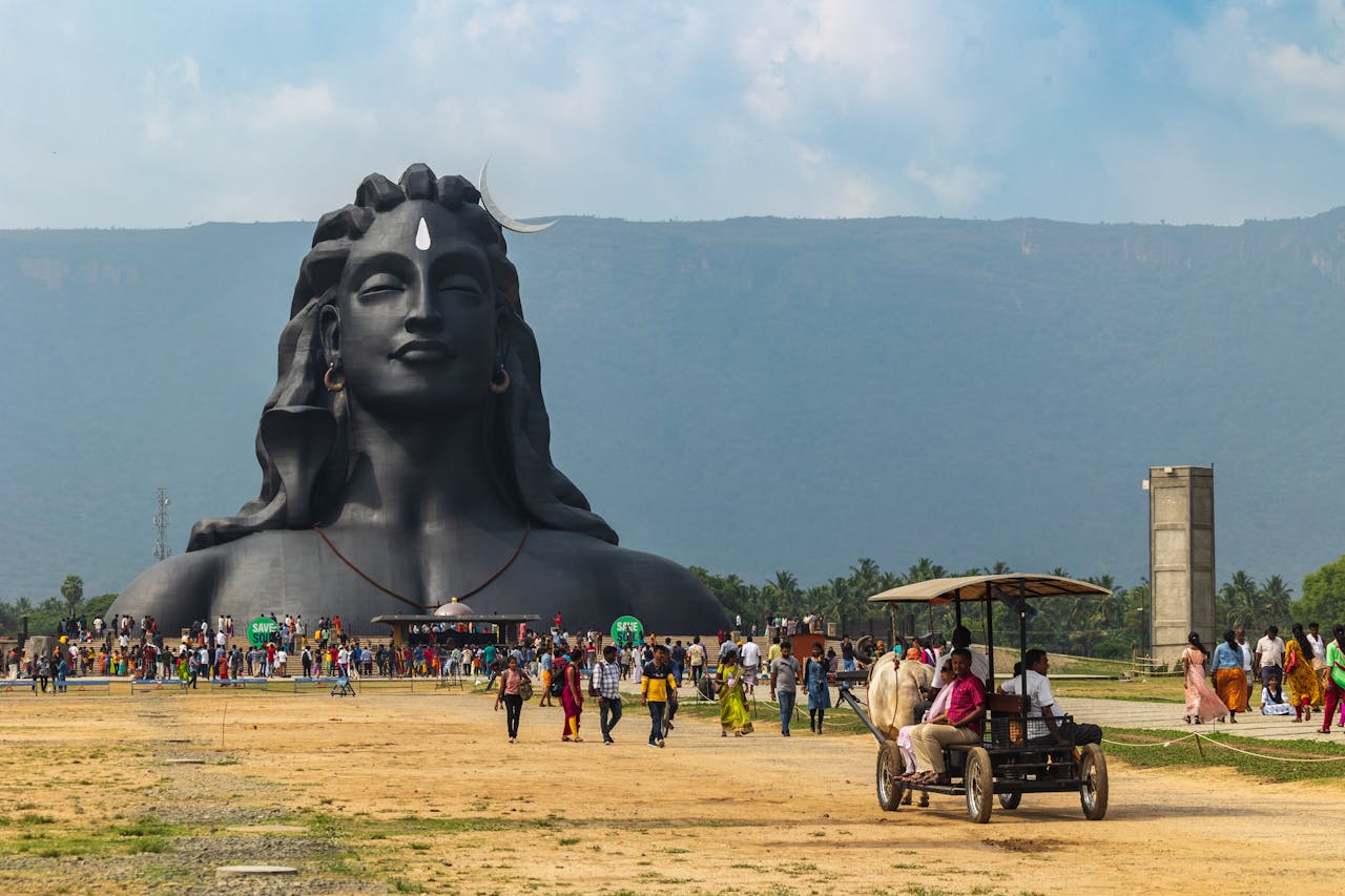 Large Bust Sculpture and People on a Field